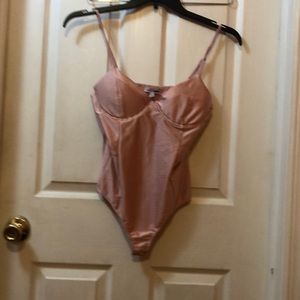 Fashion Nova body suit in color pink, size M. Gently used condition.